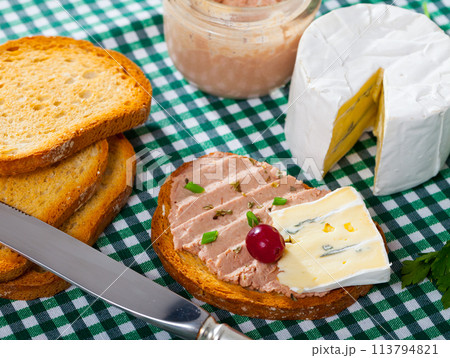 Toasted bread with rillettes and soft blue cheese Toasted bread with rillettes and soft blue cheese 113794821