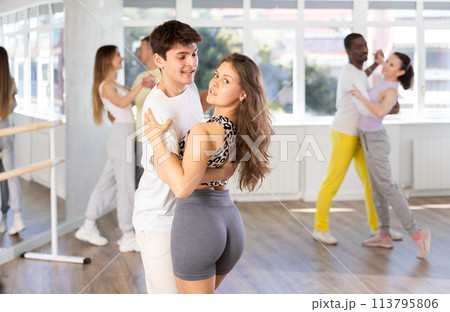 Young couple practicing passionate samba in dance class 113795806