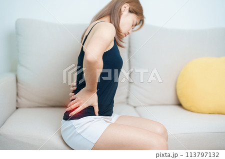 woman having back body ache during at home. adult female with muscle pain due to Piriformis Syndrome, Low Back Pain and Spinal Compression. Office syndrome and medical concept woman having back body ache during at home. adult female with muscle pain due to Piriformis Syndrome, Low Back Pain and Spinal Compression. Office syndrome and medical concept 113797132
