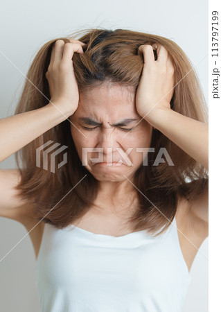 Stress, Sad and unhappy concepts. Alone asian Woman having headache, Young female feeling frustrated, exhausted and suffering 113797199