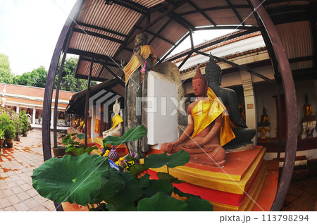 Sitting sandstone Buddha statues decorated the interior at Wat Mahathat Worawihan,which is one of the oldest temples. Located at Ratchaburi Province  in Thailand. 113798294