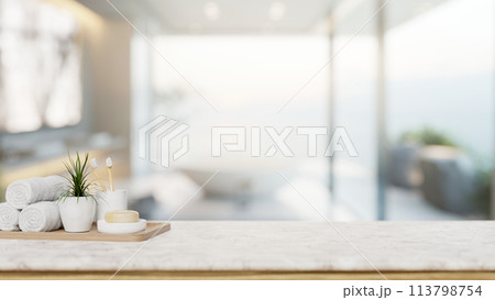 A toiletry set with an empty space for display products on a tabletop in a modern luxury bathroom. 113798754