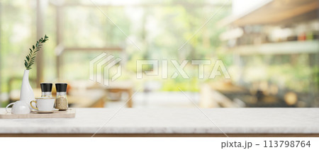 A luxury white marble kitchen tabletop in a contemporary spacious home kitchen. 113798764