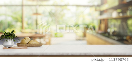 A luxury white marble kitchen tabletop in a contemporary spacious home kitchen. 113798765
