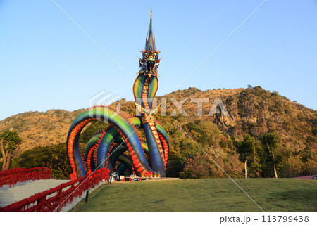 This Naga body is called Grandpa Phaya Sri Phet Khiri Mahamuni Srisutthonakarat Enshrined at Tham Chaeng Temple, it is a large and colorful Naga figure.  113799438