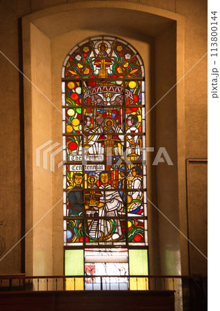 Stained glass image of Saint in the church window at The Basilica Minore del Santo Nino, the oldest church in the Philippines. Built in 1565 by Spanish colonists. 113800144