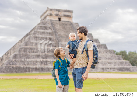 Father and two sons tourists observing the old pyramid and temple of the castle of the Mayan architecture known as Chichen Itza these are the ruins of this ancient pre-columbian civilization and part 113800874