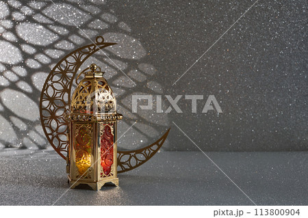 Ramadan Kareem. golden moon and lantern on glowing background for Holy month Ramadan celebration Ramadan Kareem. golden moon and lantern on glowing background for Holy month Ramadan celebration 113800904