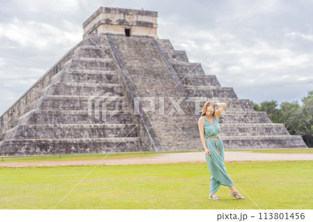 Beautiful tourist woman observing the old pyramid and temple of the castle of the Mayan architecture known as Chichen Itza these are the ruins of this ancient pre-columbian civilization and part of 113801456