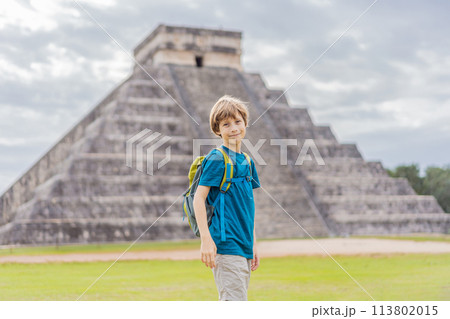 Boy traveler, tourists observing the old pyramid and temple of the castle of the Mayan architecture known as Chichen Itza these are the ruins of this ancient pre-columbian civilization and part of 113802015