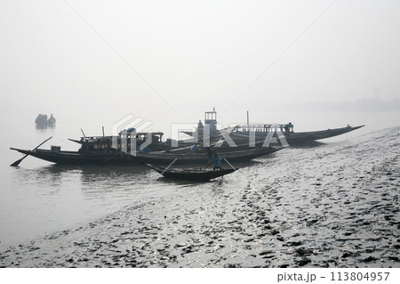 Misty morning on the holiest of rivers in India. Ganges delta in Sundarbans, West Bengal, India. Misty morning on the holiest of rivers in India. Ganges delta in Sundarbans, West Bengal, India. 113804957