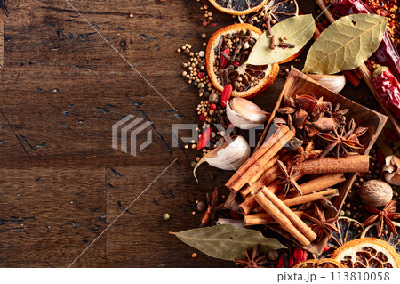 Various spices on a kitchen table. 113810058