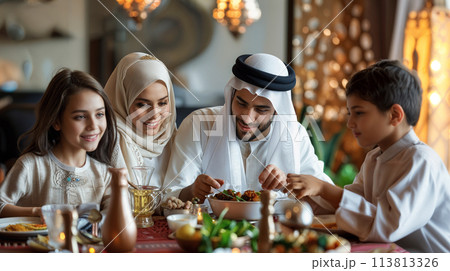 Muslim family gathering around dining table 113813326