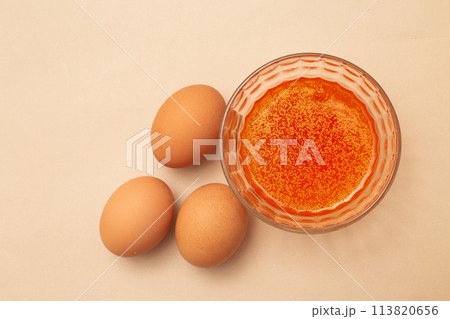 festive painted Easter eggs with colorful dyes on the table at home. festive painted Easter eggs with colorful dyes on the table at home. 113820656