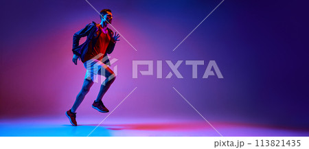 Active young man, athlete in sportswear in motion training, running on gradient pink purple background in neon light Active young man, athlete in sportswear in motion training, running on gradient pink purple background in neon light 113821435