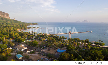 aerial view of koh mook or muk island with Pier.It is a small idyllic island in the Andaman Sea in the south of Thailand. aerial view of koh mook or muk island with Pier.It is a small idyllic island in the Andaman Sea in the south of Thailand. 113821905