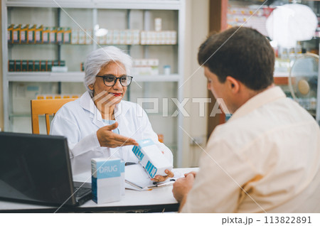 Pharmacist giving advice And advice for patients who come to buy Medicine, Drugs, Vitamins products, according to prescriptions in modern pharmacies. 113822891
