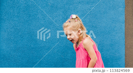 Banner Child girl walks and have fun outdoor with cochlear implant on the head. Hearing aid and treatment concept. Copy space. Inclusion and people with disability 113824569