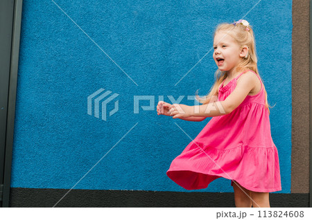 Child with hearing problem and cochlear implant dance in street, deaf kid began to hear. Hearing loss in childhood and treatment concept. Inclusion and people with disability. Copy space Child with hearing problem and cochlear implant dance in street, deaf kid began to hear. Hearing loss in childhood and treatment concept. Inclusion and people with disability. Copy space 113824608