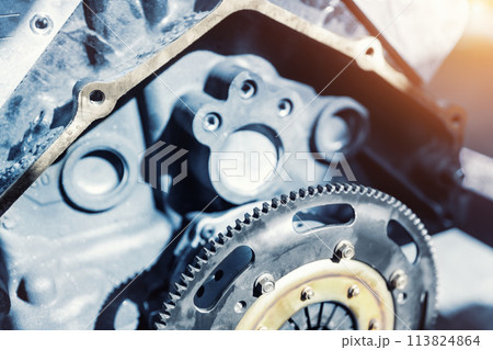 Closeup car racing motorsport  engine flywheel parts  garage workshop workbench repair factory station fix service maintenance. Vehicle part detail. Mechanical precision  automotive engineering 113824864