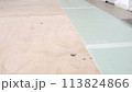 A man lays a laminate on the floor in a room, a time lapse. 113824866
