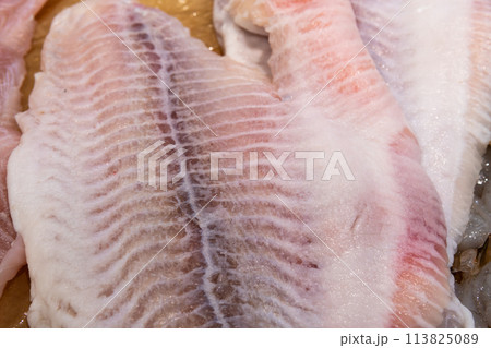 Fresh fish lies on ice in a supermarket Fresh fish lies on ice in a supermarket 113825089