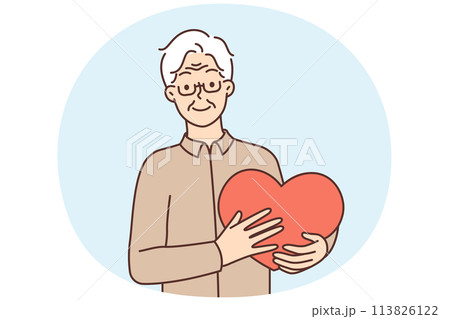 Smiling mature man hold big heart in hands 113826122