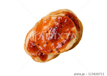 Fresh baked pancakes with delicious jam on a ceramic plate 113826711