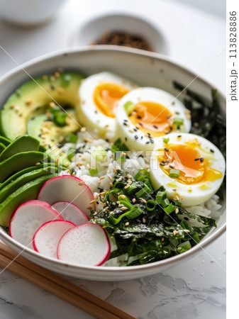 Bowl of Rice and Vegetables With Chopsticks 113828886