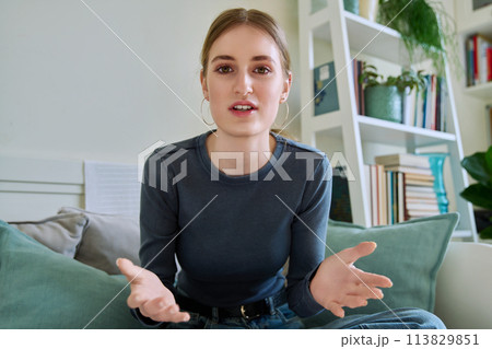 Web camera view of teenage girl talking looking in camera, online meeting, video call 113829851