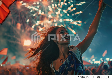 Woman Enjoying Fourth of July Fireworks and Festivities with American Flag Woman Enjoying Fourth of July Fireworks and Festivities with American Flag 113831081