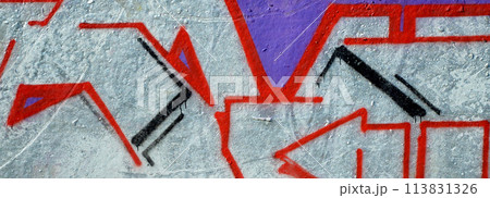Colorful background of graffiti painting artwork with bright aerosol outlines on wall. Old school street art piece made with aerosol spray paint cans. Contemporary youth culture backdrop 113831326