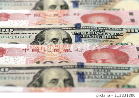 Many money bills of People Republic of China and United States. PRC Yuan and USD dollars banknotes close up 113831800