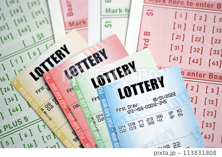 Lottery tickets of different colors on blank bills with numbers for playing lottery close up 113831808