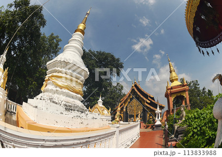 White Pagoda with a golden crown and tiers. It is a relic that has existed since the beginning on top of mountain at Wat Pra That Doi Pra Chan. 113833988
