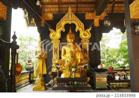 Golden Buddha sitting Decorated in the pavilion At Wat Phra That Doi Phra Chan for Buddhists to worship. Located at Lampang Province in Thailand. Golden Buddha sitting Decorated in the pavilion At Wat Phra That Doi Phra Chan for Buddhists to worship. Located at Lampang Province in Thailand. 113833998