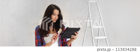 Renovation Ideas From Internet During Room Repair by Asian Casual Girl 113834288