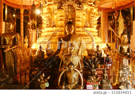 Luang Phor Phet, the principal Buddha image and beautiful Buddha statues that are hundreds of years old inside the chapel at Wat Phra That Chom Thong Worawihan. Located in Chiang Mai ,Thailand. 113834851
