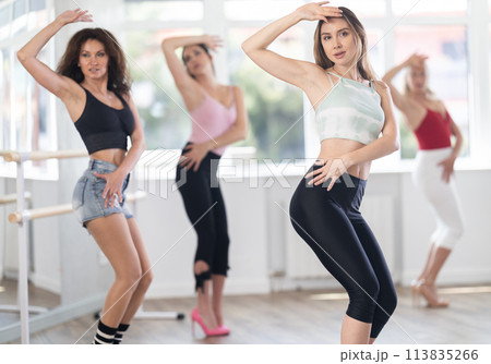 Young woman dancing high heels in group 113835266