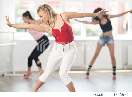 Adult woman dancing high heels in group 113835686