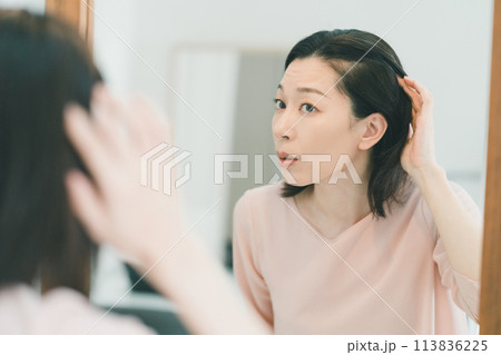 a forty-something woman a forty-something woman 113836225