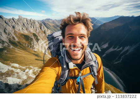 Happy hiker man taking selfie portrait on the top of mountain 113837222