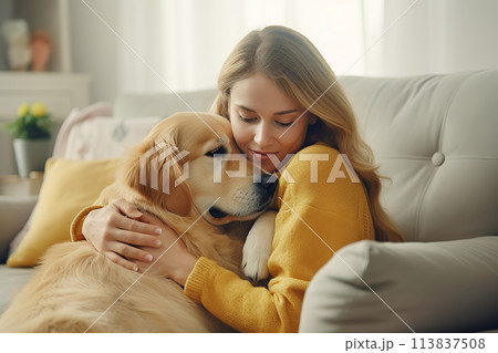 Depressed woman hugs the dog while sitting on the sofa. Having a pet helps you cope with sadness 113837508