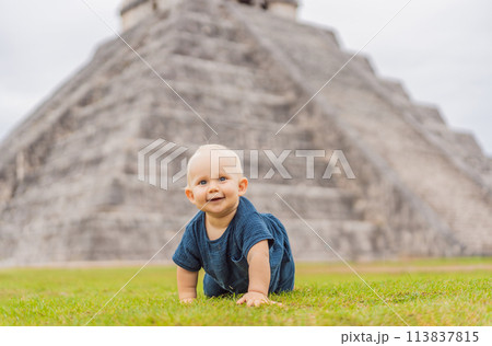 Baby traveler, tourists observing the old pyramid and temple of the castle of the Mayan architecture known as Chichen Itza these are the ruins of this ancient pre-columbian civilization and part of 113837815