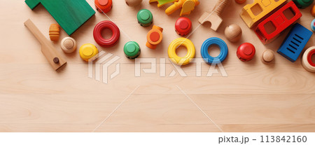 AI generated Top view of kids toys frame on wooden background with copy space. AI generated Top view of kids toys frame on wooden background with copy space. 113842160