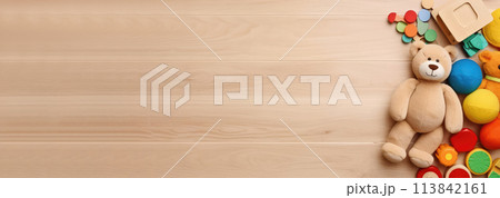 AI generated Top view of kids toys frame on wooden background with copy space. AI generated Top view of kids toys frame on wooden background with copy space. 113842161