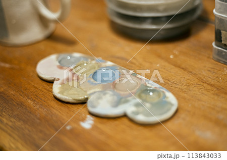 Close up potter painting 113843033