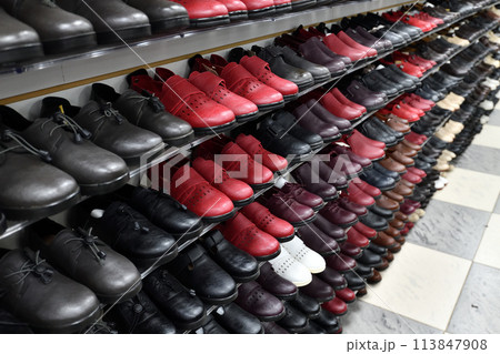 Children's leather demi-season shoes on the store counter Children's leather demi-season shoes on the store counter 113847908