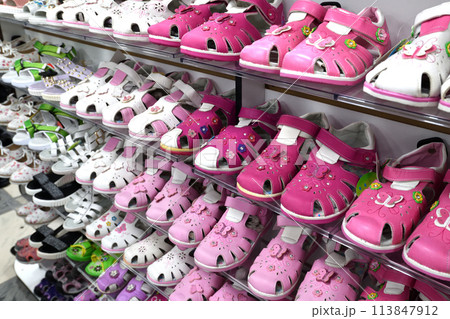 Children's Shoes on the store counter Children's Shoes on the store counter 113847912