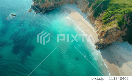 A beautiful beach with a rocky cliff in the background A beautiful beach with a rocky cliff in the background 113848402